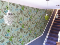 Wallpaper over dado rail on stairs